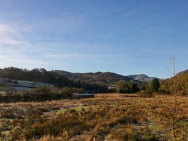 A landscape with a lake and mountains at Norwood House in Ambleside