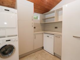 A kitchen with appliances and cabinets at Norwood House in Ambleside