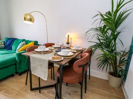 A dining area with a table set for a meal at Seagull & Chips in Weymouth