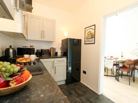 A kitchen with appliances and fruit bowl at Seagull & Chips in Weymouth