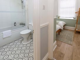A bathroom with a bathtub and a toilet at Seagull & Chips in Weymouth