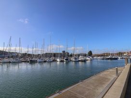 A marina with boats docked at Seagull & Chips Weymouth