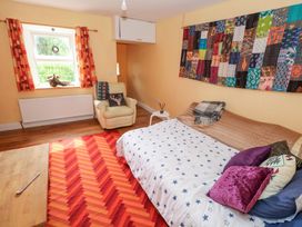 A bedroom with a bed and a chair at Huath in Carrick on Shannon