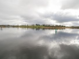 A water body with a buoy and trees at Huath in Carrick on Shannon