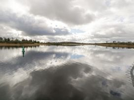A lake with a buoy and reflections of clouds at Huath in Carrick on Shannon