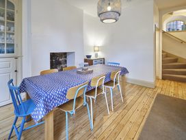 A dining room with a table and chairs at Beachside Cottage Sandsend