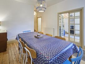 A dining room with a table and chairs at Beachside Cottage in Sandsend