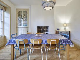 A dining room with a table and chairs at Beachside Cottage in Sandsend
