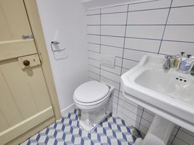 A bathroom with a toilet and sink at Beachside Cottage in Sandsend