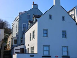 A house with multiple windows and stairs at Beachside Cottage in Sandsend