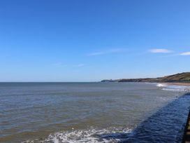 A view of the sea and coastline at Beachside Cottage in Sandsend
