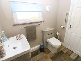 A bathroom with sink and toilet at Amblers Rest in Amble