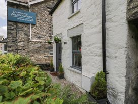 An outdoor view of a building with a sign at Squirrel Cottage in Betws-Y-Coed