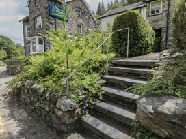 Stairs leading to a building with plants at Squirrel Cottage Betws-Y-Coed