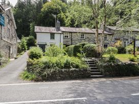 A house with steps and greenery at Squirrel Cottage in Betws-Y-Coed