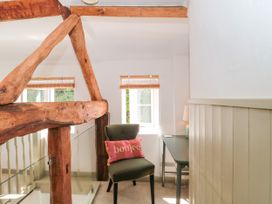 An office space with a chair and desk at Old Farm Cottage in Warminster