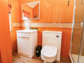 A bathroom with sink and toilet at Masons Hut in West Mains near Haggerston
