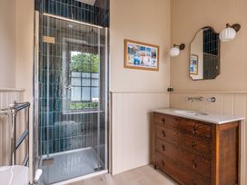 A bathroom with a shower, sink, and toilet at The Old Vicarage in Merriott