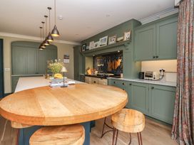 A kitchen with an island and appliances at The Old Vicarage in Merriott