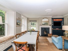 A dining room with a table and chairs at The Old Vicarage in Merriott