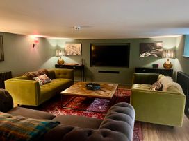 A living room with sofas and a coffee table at The Old Vicarage in Merriott