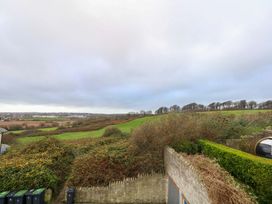 A view of fields and hills with trees at Corner Cottage Preston