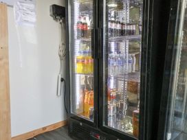 A refrigerator with drinks in Mini pod Staintondale near Burniston