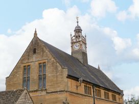 A building with a clock tower at Elm Cottage Moreton-In-Marsh