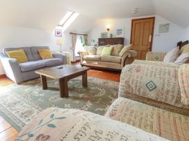 A living room with sofas and a coffee table at The Cottage in St. Ives