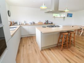 A kitchen with a countertop and appliances at Swallows Nest St. Ives