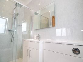 A bathroom with a shower and sink at Swallows Nest in St. Ives