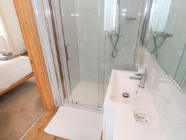 A bathroom with a shower and sink at Swallows Nest in St. Ives