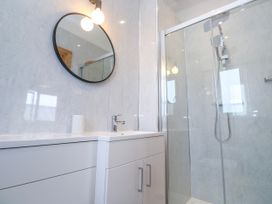 A bathroom with a shower and sink at Swallows Nest in St. Ives
