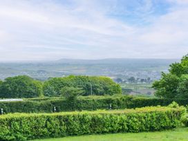 A scenic view of trees and fields at Swallows Nest in St. Ives