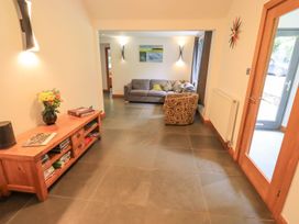 A living room with a sofa and armchair at Bracken Ground in Coniston
