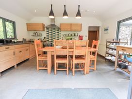 A kitchen with a dining table and chairs at Bracken Ground in Coniston