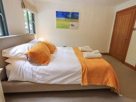 A bedroom with bed and pillows at Bracken Ground in Coniston
