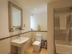 A bathroom with a sink, toilet and towel rail at Bracken Ground in Coniston