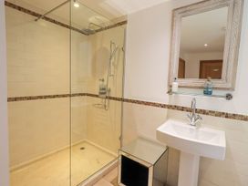 A bathroom featuring a shower and sink at Bracken Ground in Coniston