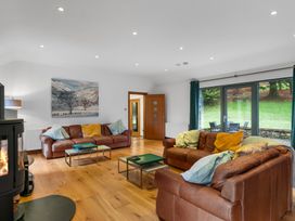 A living room with sofas and a coffee table at Bracken Ground in Coniston