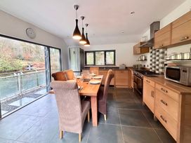 A kitchen with a dining table and chairs at Bracken Ground in Coniston