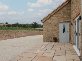 An entrance area with a door and a plant pot at Foxes Den Pendomer near Yeovil, Somerset