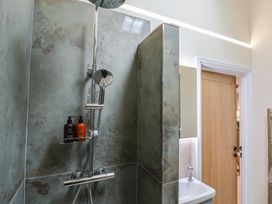 A bathroom with a shower and sink at Foxes Den Pendomer near Yeovil Somerset