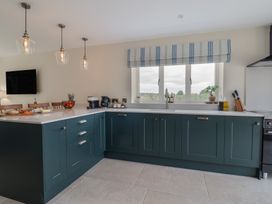 A kitchen with a countertop, sink, and coffee machine at Foxes Den Pendomer near Yeovil, Somerset