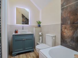 A bathroom with a sink and toilet at Foxes Den in Pendomer near Yeovil, Somerset
