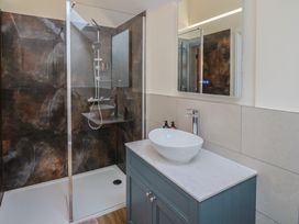 A bathroom with a shower and sink at Foxes Den near Pendomer near Yeovil, Somerset
