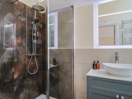 A bathroom with shower and sink at Foxes Den Pendomer near Yeovil, Somerset