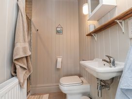 A bathroom with a sink and toilet at 4 bed in Anglesey