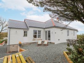 A house with outdoor seating area at 4 bed in Anglesey