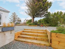 An outdoor area with stairs and a picnic table at a 4 bed in Anglesey